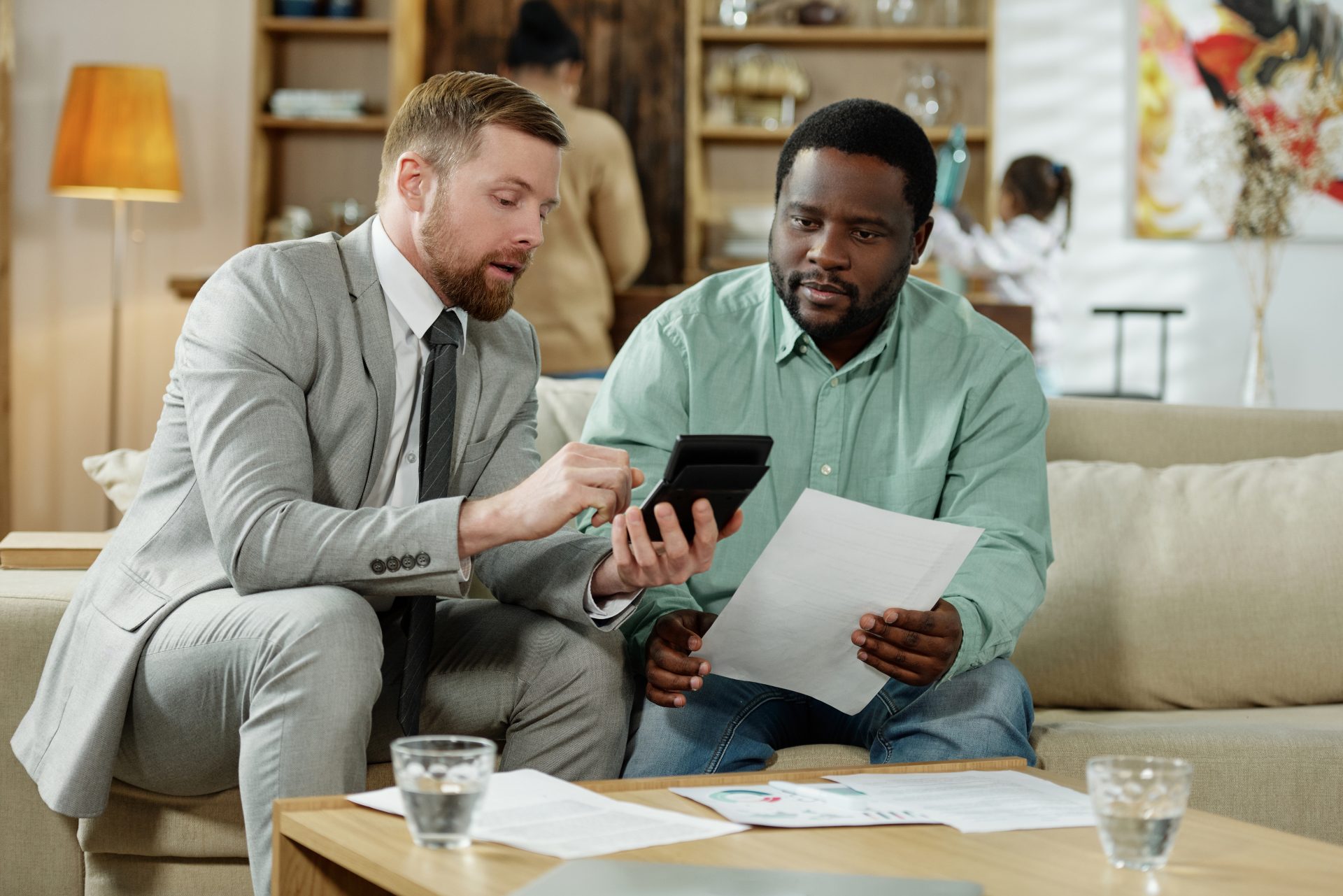 man with adviser calculating 1