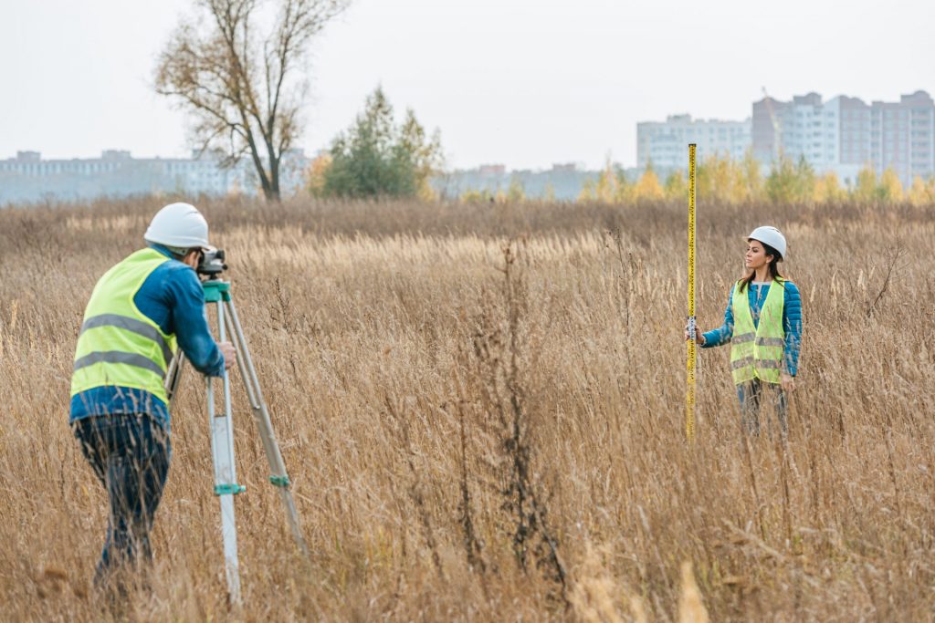surveyors measuring land with digital level in fie 2023 01 06 19 19 01 utc