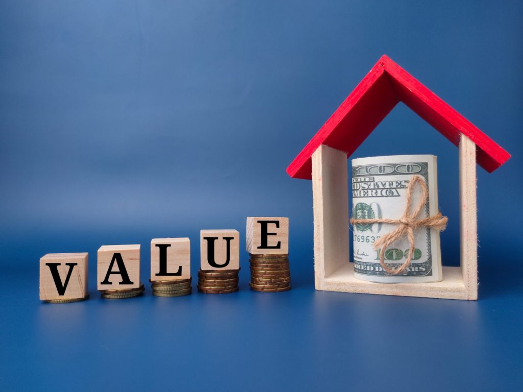 toy house and banknote with the word value on a bl 2022 10 24 23 23 18 utc