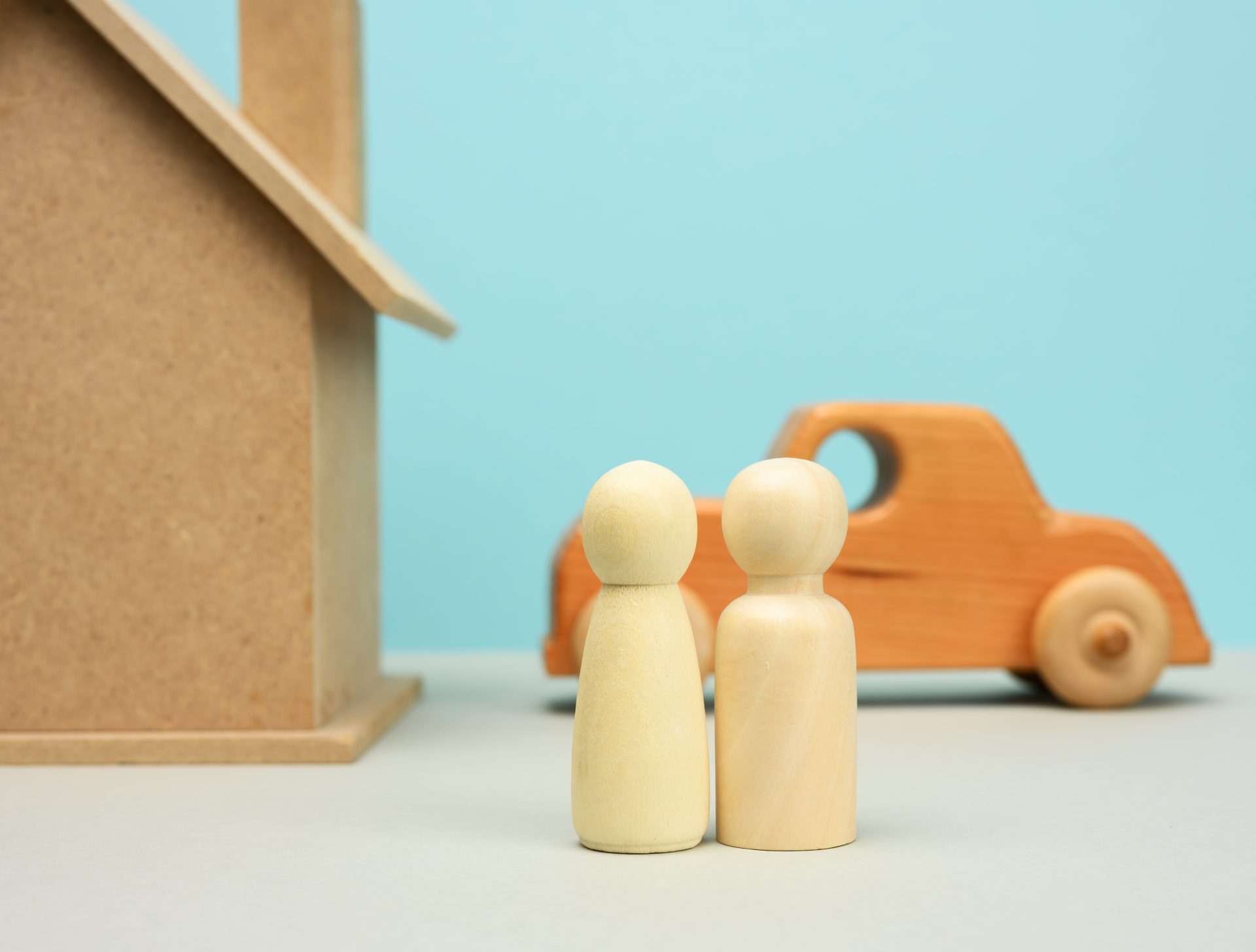 wooden house and car with miniature family figures 2022 06 20 13 59 25 utc