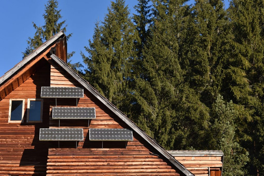 solar panel on a wooden cottage in the forest 2021 08 26 16 21 45 utc